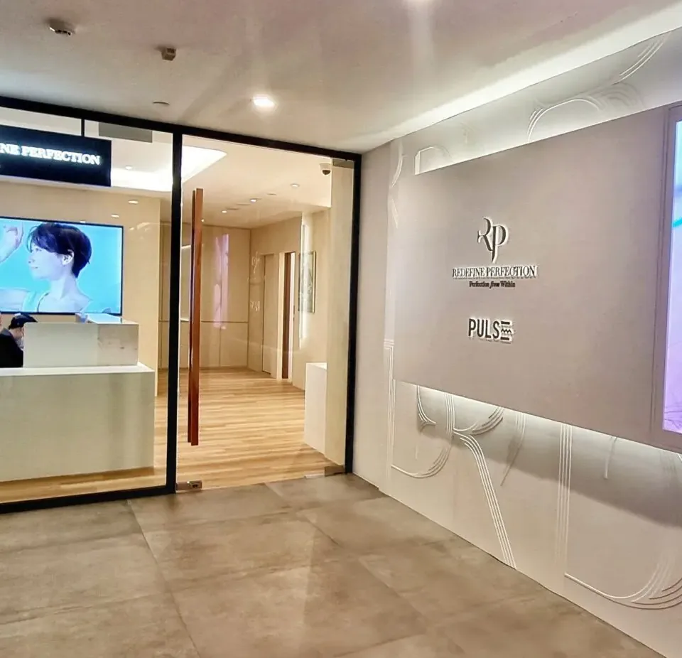 Glass entrance and reception at Redefine Perfection PULSE TCM, Tang Plaza
