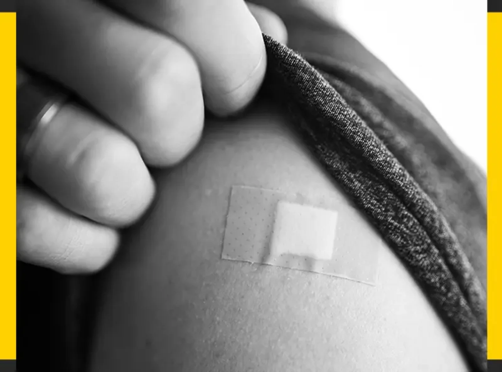 Close-up of an upper arm with a bandage after vaccination at PULSE TCM