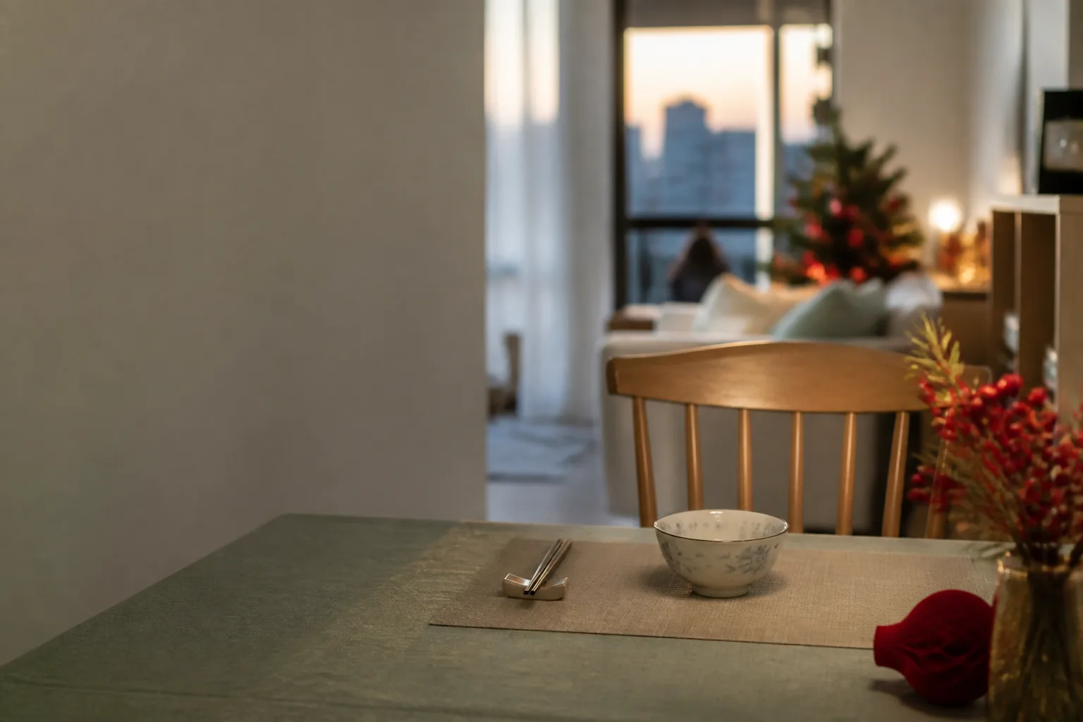 Single place setting with chopsticks and a quiet festive table, illustrating holiday blues solitude