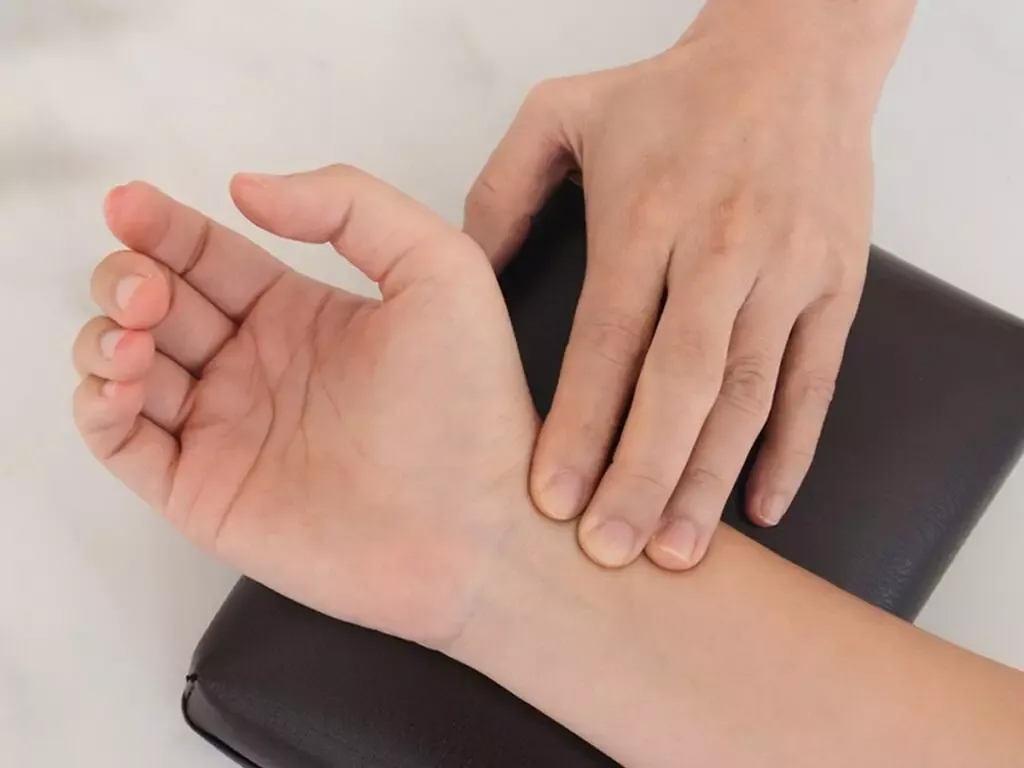 Physician assessing a patient before acupuncture at PULSE TCM