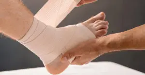 ankle sprain being bandaged