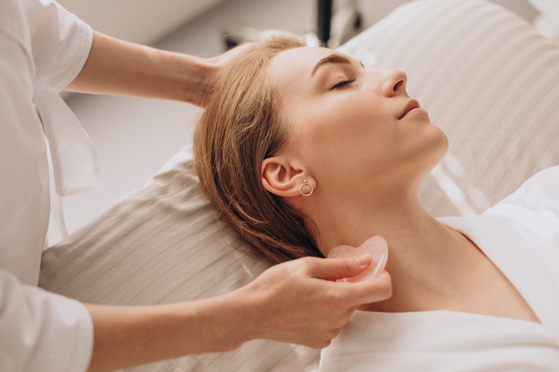 A woman receiving gua sha therapy